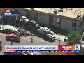 Semi-truck carrying cars crashes into apartment building in San Fernando Valley