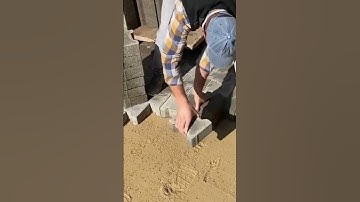 the process of installing paving blocks in the large yard of a building #construction #popular