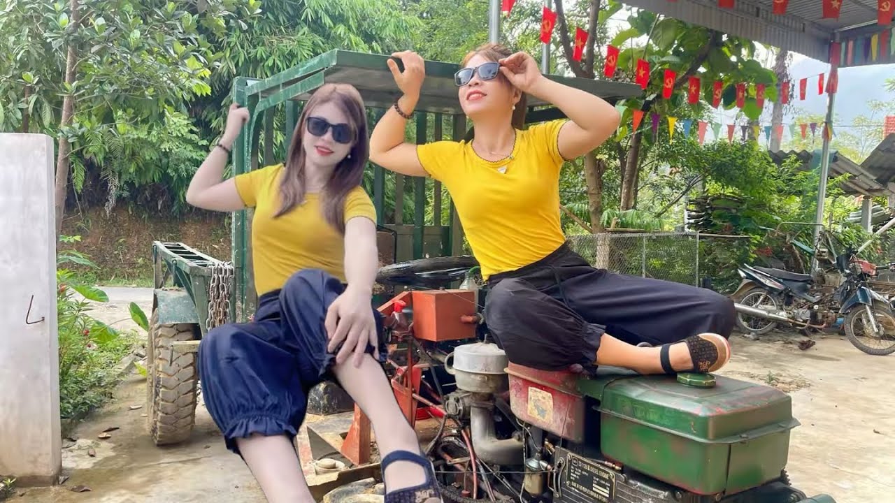 Talented female mechanic: repairing and installing sunshade for tractor