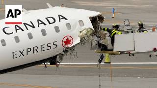Crews tow away plane after deadly crash at LaGuardia airport