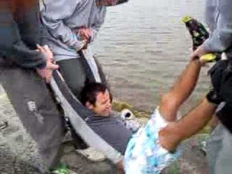 Guy gets thrown in a river