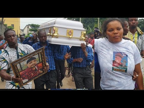 Wife Of Mad Melon of 'Danfo Driver's Looking So Sad As His Son Dance With His Casket At The Burial