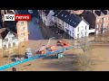 UK floods: Residents in tears as barriers breached in Worcestershire town
