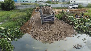 Be Watchful! Start New Landfill Use Komatsu Dozer Push Soil & Dirt into Huge Pond with Truck Unload