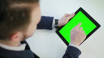 Man Using A Tablet With A Green Screen Stock Video