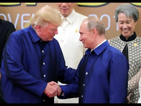 Trump and Putin shake hands at APEC summit dinner