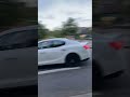 a Maserati ghibli leaving a car meet