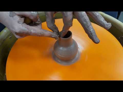 Playing on the pottery wheel