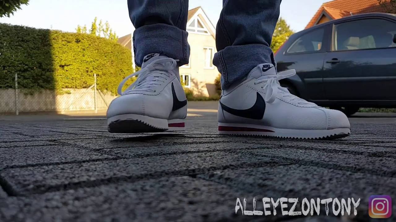 nike cortez black and white on feet