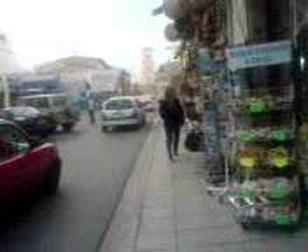 Trunk tourist woman walking across the street in Larnaca...screaming "Cypriot Malaka"