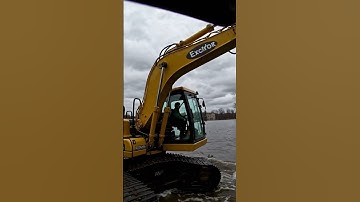 Excavator in danger of flooding