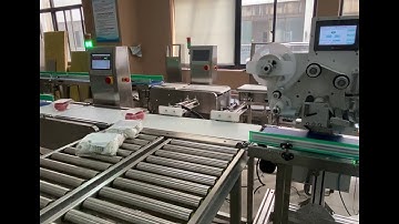 Automatic labeling checkweigher