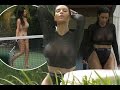 Kim Kardashian flashes boobs in black sheer top before racy game of tennis in tiny bikini