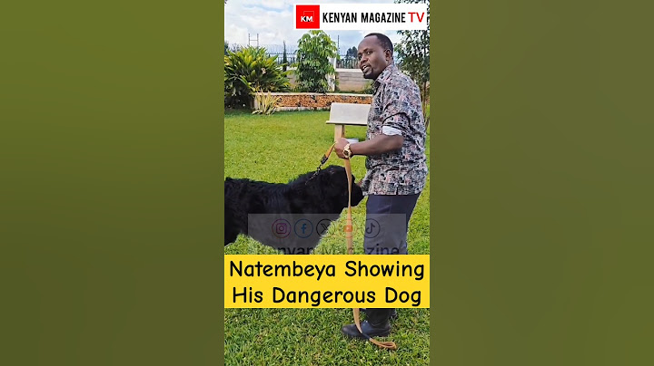 George Natembeya shows off his Big Black Dog in his Residence backyard in Trans Nzoia County