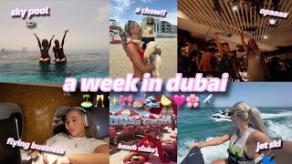 a week in dubai 🌞 | girls trip!! | flying business, aura skypool, beach clubs, dubai floods & more!!