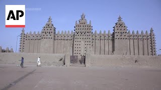 Mali's iconic mud brick mosque restored amid conflict and collapse of tourism