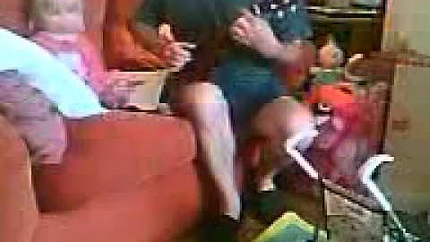 Roy Broughton playing bluesy ukulele at 7a.m. to a...