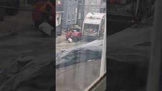 A City of Philadelphia trash truck International Airflo picking up trash 