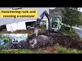 Hammering rock and using a conveyor belt to load the truck