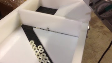 Dual path conveyor with 20:1 speed ratio for maximum part separation.