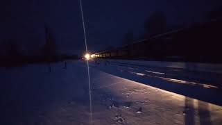 2TE116-1042 (Baltijas Ekspresis) with empty coal cars passing station Daudzeva