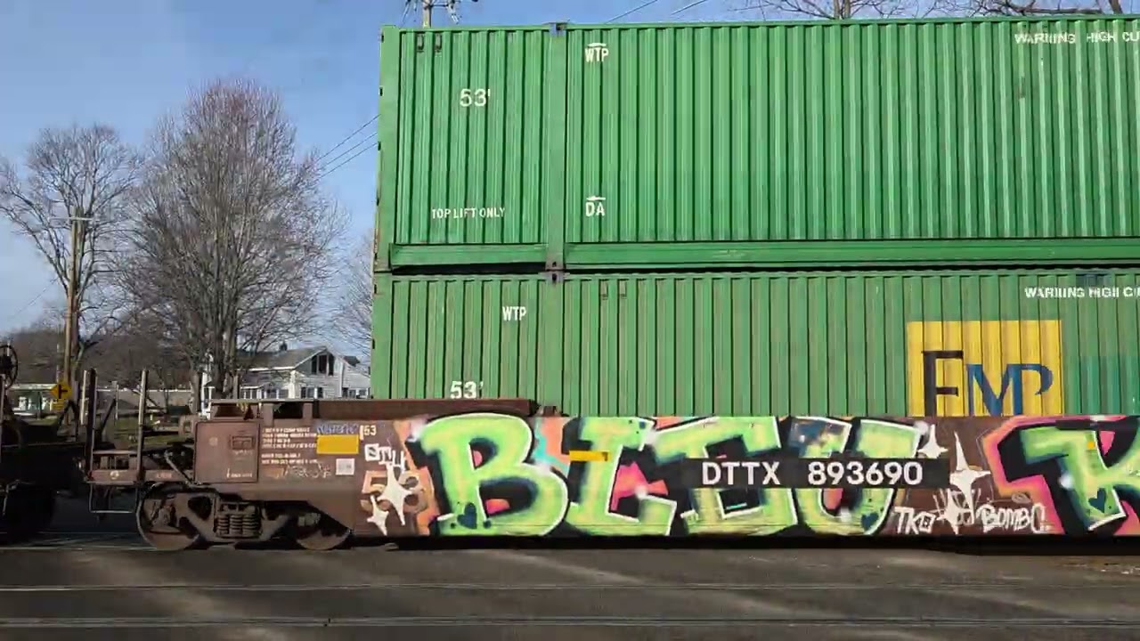 CN 2767, 2667 Westbound intermodal container in well car, auto rack train passes Vicksburg, MI