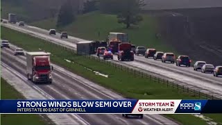 Strong winds blow semi-truck over on Interstate 80