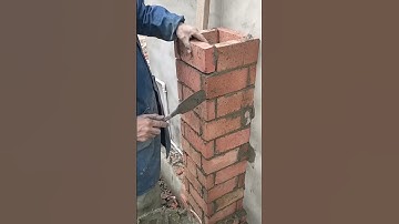 Skilled bricklayer making brick chimney 💯