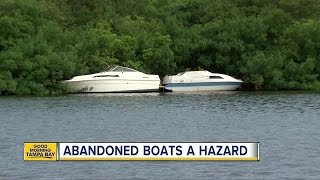 Dozens of abandoned boats are littering Tampa Bay waterways