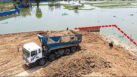 New action!! Skills operator bulldozer pushing soil with big dump truck unloading soil
