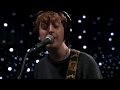 Boy azooga  face behind her cigarette live on kexp