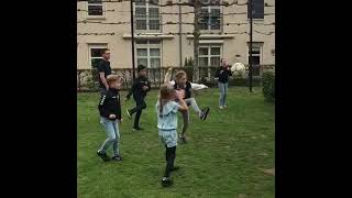 Boy kicks soccer ball and lands on boys face