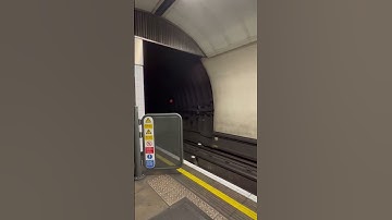 Thumbnail of EXTREME SPEED, London underground train approaches platform at high speed.