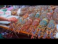 مأكولات بحرية من سوق ليلي  سمك بلطي مخبوز  جراد بحر مشوي  كعك محار
