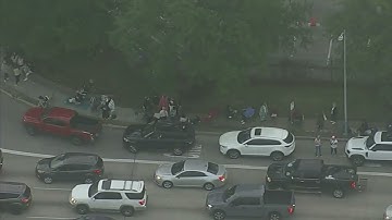 Taylor Swift fans form long lines outside NRG for merch
