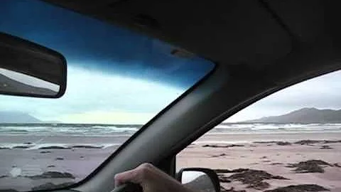 Cathleen and Frank driving on Inch Beach in Ireland!