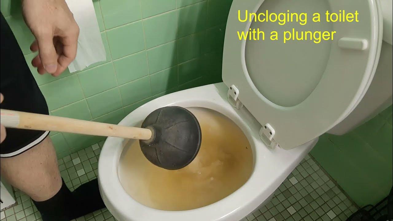 How to unclog a toilet with a plunger youtube