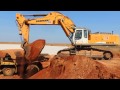 R974C Liebherr loading 769 and 770 CAT