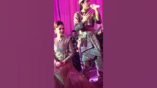 The groom Akim singing for the bride Stacy