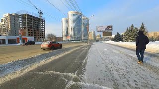 Rich middle class of Novosibirsk lives on this street. Walking on the Kirov street in winter. Russia