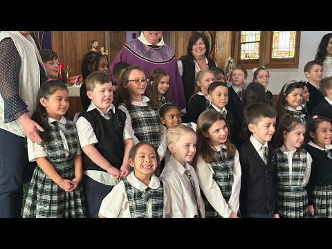 Holy Angels Regional School Mass. Louella reading the Gospel