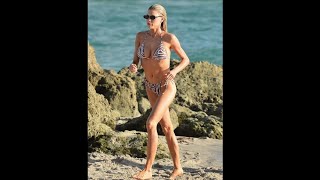 Charlotte McKinney is every inch the beach bombshell in zebra string bikini while vac tioning with b