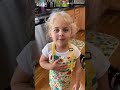 Adorable girl practices the pledge of allegiance