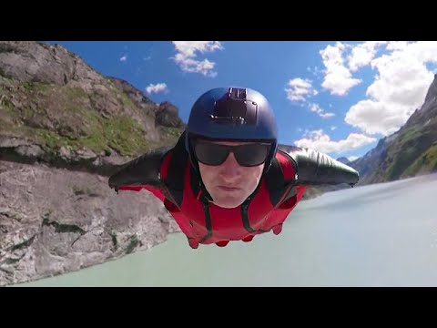 Wingsuit Flying Over a Dam and Dam Wall