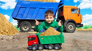 Construction Vehicles - A large Dump Truck brought sand, a Bruder Dump Truck helps him