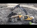 Jätteen käsittely kaatopaikalla Volvo 210B kaivinkone