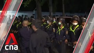 Thai police fire tear gas, water cannon at hundreds of protesters outside parliament