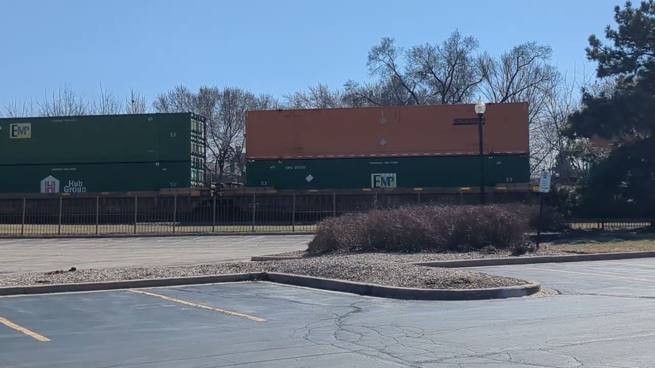 (SD70M spotted!) Westbound UP Intermodal/Piggyback train passing the library at West Chicago 