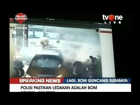 Indonesian police say sucide bombing family attacks Surabaya police headquarters