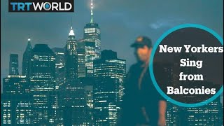New Yorkers sing from balconies to lift community spirits
